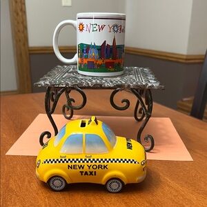New York City souvenirs.  New York City cup and taxi bank.